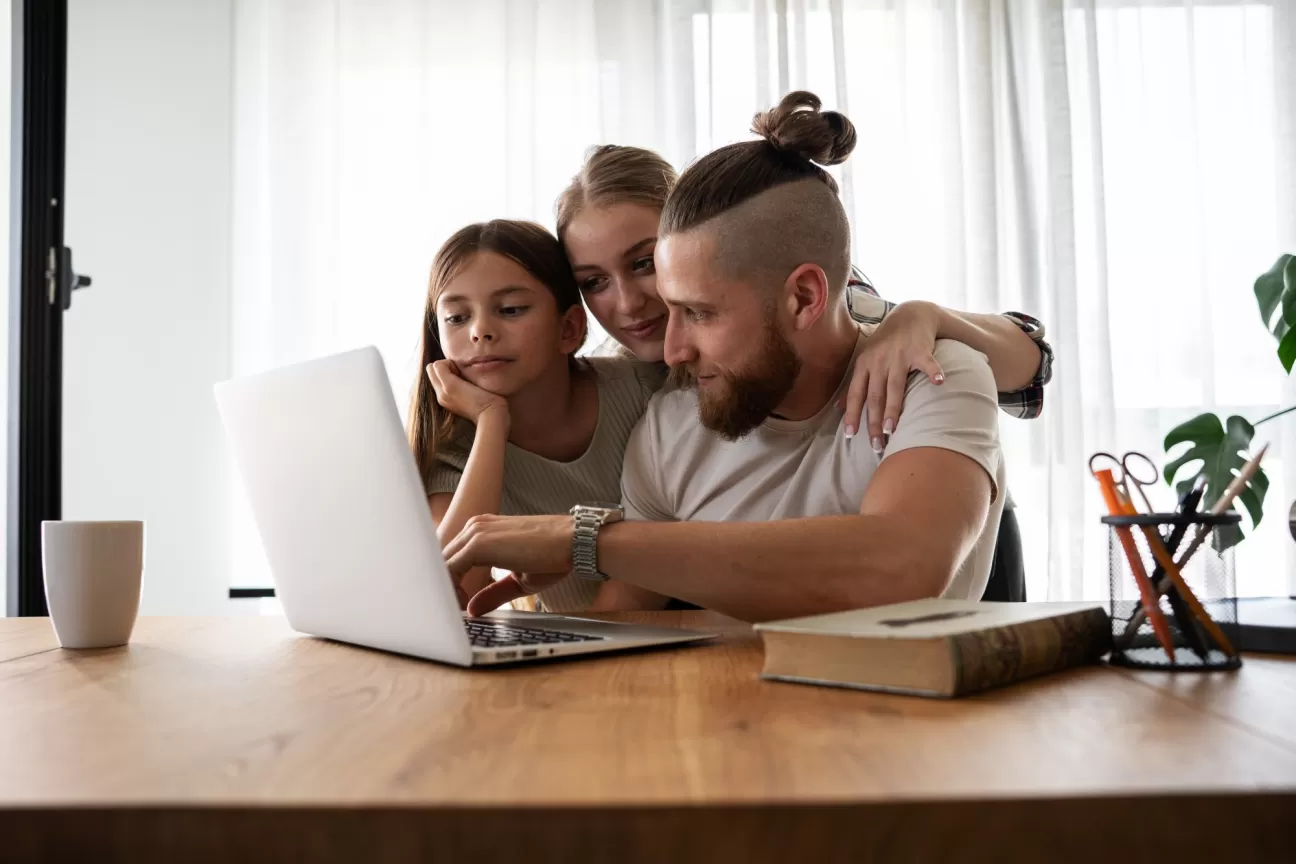 family at laptop online recovery program.