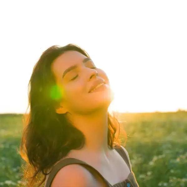 A woman feeling relaxed and happy