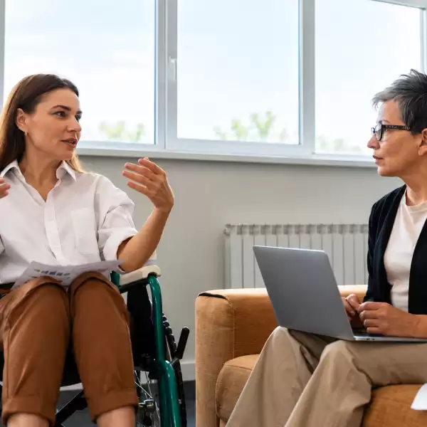 Two people discussing recovery support