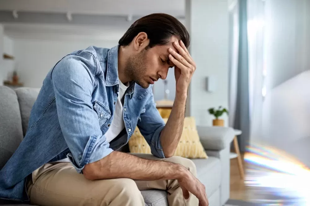 Man Feeling Overwhelmed by Stress and Depression at Home